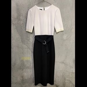 Ted Baker work/cocktail dress. White top, black bottom. Belted accent.